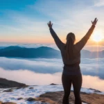 bright dawn, a woman standing on top of a mountain with his arms in the air, triumphantly, standing on mountain, at the top of a mountain, insurmountable, on the top of a mountain, girl standing on mountain, a person standing in front of a, inspire and overcome, victorious on a hill, standing on a mountain top, rise above clouds